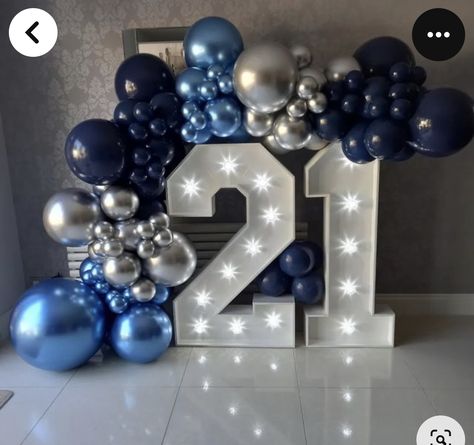 Blue Balloon Garlands, 21 Light Up Numbers With Balloons, 21 Balloon Garland, Blue And Silver Backdrop Ideas, Led Numbers With Balloons, Navy Blue And Silver Birthday Cake, 21st Birthday Backdrop Ideas For Guys, Blue 21st Birthday Decorations, Balloon Garland With Numbers