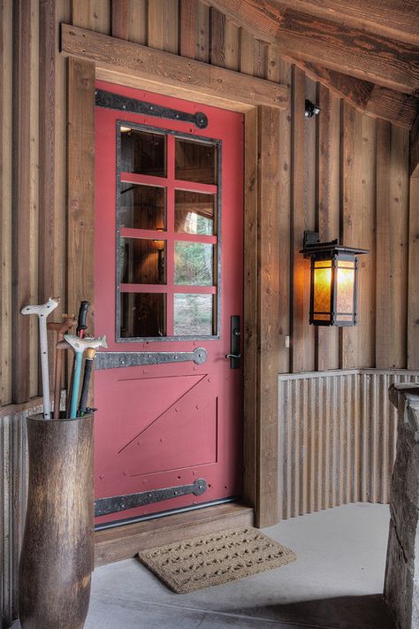 The History and Charm of a Red Front Door - Town & Country Living Wood Siding Exterior, Wainscoting Styles, Red Front Door, Steel Siding, Door Design Photos, Cabin Doors, Rustic Exterior, Cabin Exterior, Metal Siding