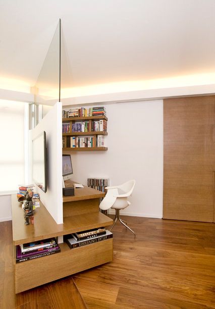 Unconventional design and layout creates an extraordinary space for a study in a trapezoid-shaped living room. Wood is used extensively to foster a welcoming warmth in the home. Fake Walls, Minimalist Dekor, Minimalist Home Office, Contemporary Home Office, Interior Minimalista, Separate Living Room, Design Apartment, Room Dividers, Home Office Space