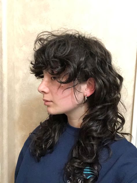 medium length wavy hair, mullet or shag style haircut Curly Shag Wolfcut Haircut, Shullet Hairstyles Long Curly, Mullet Hairstyle Wavy Hair, Long Shaggy Mullet Curly Hair, Shag Mullet Curly Hair Long, Long Curly Shag Mullet, Rock Haircuts For Women, Shaggy Mullet Wavy Hair, Curly Hair Mullet Long