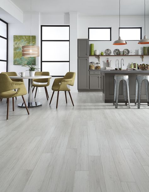 Classic European styling pairs perfectly with the understated beauty of light gray to offer tranquil charm in Alpine Oak Laminate. It's a refreshing style that's both timely & timeless! http://www.lumberliquidators.com/ll/c/Alpine-Oak-Dream-Home-XD-10AO/10039949 Grey Laminate Flooring Kitchen, Light Grey Hardwood Floors, Light Grey Wood Floors, Grey Wood Floors Kitchen, Gray Wood Tile Flooring, Wood Tile Floor Kitchen, Light Grey Flooring, Grey Wood Tile, Grey Hardwood Floors