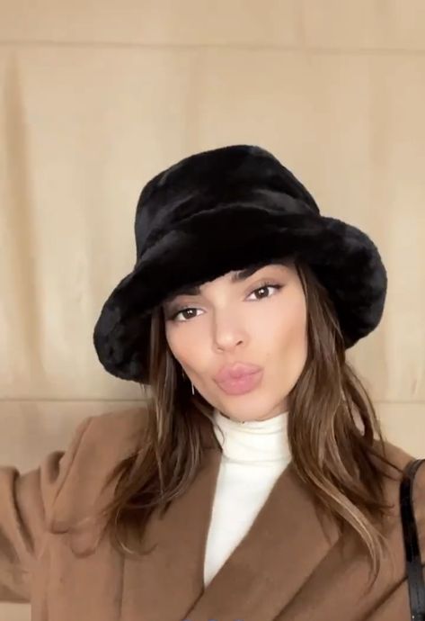 kendall jenner in black fuzzy bucket hat Faux Bucket Hat Outfit, Kendall Jenner Bucket Hat, Black Fur Bucket Hat, Puffy Hat Outfit, Black Fuzzy Bucket Hat Outfit, Black Fur Bucket Hat Outfit, Fuzzy Bucket Hat Outfit Winter, Black Bucket Hat Outfit Winter, House Of Sunny Cardigan Outfit