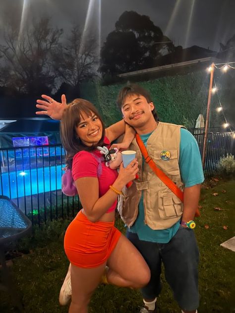 100+ Popular #HalloweenCostumes that are setting trends this year - Hike n Dip Halloween Dora The Explorer, Diego From Dora The Explorer, Dora And Boots Costume Women, Dora And Diego Couple Costume, Dora And Swiper Costume, Dora Diego Costume, Dora The Explorer Halloween Costume, Dora The Explorer Cosplay, Dora And Diego Costume Halloween