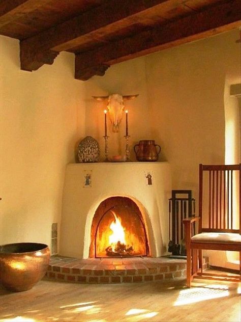 Southwestern style corner adobe fireplace with raised brick hearth Adobe Fireplace, Southwest House, Ideas Terraza, Southwest Living, Kiva Fireplace, Santa Fe Home, Brick Hearth, Adobe Home, New Mexico Homes