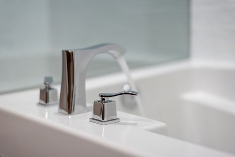 A garden tub faucet, like a Roman faucet, mounts to a deck on the tub itself, and replacing one is similar to replacing a bathroom or kitchen sink faucet. Garden Bathtub, Master Tub, Industrial Pipe Furniture, Jetted Bath Tubs, How To Clean Rust, Roman Tub Faucets, Faucet Design, Soaker Tub, Roman Tub