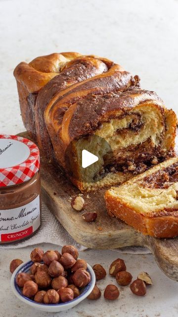 Shane Smith Online Cookery School on Instagram: "Hazelnut Chocolate Babka Loaf Recipe
🌰
This sweet braided bread is layered with the NEW Bonne Maman CRUNCHY hazelnut chocolate spread. It's palm oil free & made with the best ingredients. I mean, what more could you ask for?
🌰
Serves: 6
Prep: 2hrs
Bake: 30mins
🌰
Dough
280g plain flour
7g active dried yeast
30g caster sugar
pinch salt
2 medium eggs
75ml milk
80g butter, soft
🌰
Filling
200g Bonne Maman Hazelnut Chocolate Spread
30g chopped toasted hazelnuts
🌰
Soaking syrup
60g caster sugar
50 ml water
🌰
Method
Grease and dust a 2lb loaf tin, set aside.
Into your mixing bowl fitted with the dough hook, add the salt, flour, sugar and yeast. 
To this add the eggs, milk & mix for 5 minutes until a firm dough is reached.
At this point, add in Hazelnut Loaf Cake, 2lb Loaf Tin Cake Recipes, Date Loaf Moist, Banana Date And Walnut Loaf, No Knead Spelt Bread Dutch Oven, Chopping Knife, Kitchen Cloth, Hazelnut Chocolate, Chocolate Babka