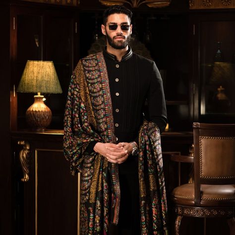 Defining sophistication with every layer, this Pashtush men's fine wool shawl, adorned with an ethnic design on black, is a testament to the timeless appeal of the Lohi. 🖤✨ #EthnicElegance #PashtushLohi #WoolenWarmth #MensShawl #SartorialStatement #TraditionalTextiles #ElegantDrapes #BlackShawl #FashionHeritage #MensStyle #finefabrics #luxurystyle #mensfashion #classiclook #styleicon #ethnicwear #moderntraditions #fashionforward #heritagewear #designerdrape #menwithstyle #elegance #fashions... Indian Wedding Clothes For Men, Shawl Outfit, Sherwani For Men Wedding, Wedding Kurta For Men, Mens Luxury Lifestyle, Indian Groom Wear, Men's Ethnic Wear, Wedding Outfit Men, Indian Men Fashion