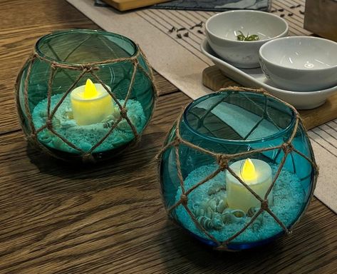 Glass Float dia 5". LED tealight not included, sand and shells inclued in packing. Teal and blue set of 2 pack. Perfect decoration for your coastal farmhouse and beach room. Teal And Gold Beach Wedding, Glass Floats Decor, Tropical Round Table Decor, Beachy Boho Wedding Decor, Sailor Centerpieces, Under The Sea Balloon Centerpieces, House Boat Decor, Ocean Table Decorations, Ocean Centerpieces