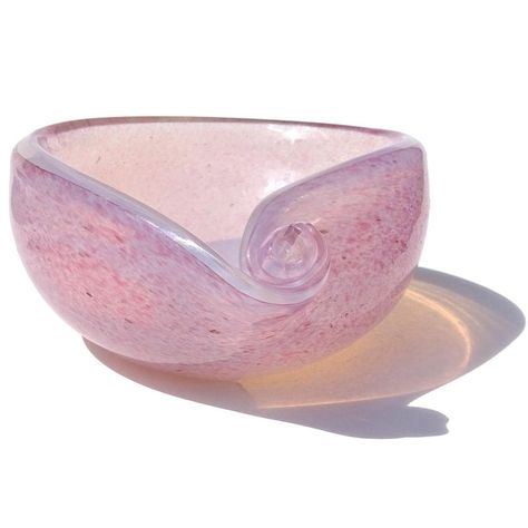 Beautiful vintage Murano hand blown opalescent white and pink spots Italian art glass decorative seashell shape bowl / vide-poche. It has been attributed to the Fratelli Toso company. The bowl has an inner layer of transparent white opal glass, covered with an outside layer of pink. The pink color is made with thousands of tiny color pigment dots. It also has a scroll shell decoration at one end. When the sun hits it you can see the an orange shadow, created from what they call "fiery opal" glas Shabby Chic Bowl, Seashell Glasses, Melted Bead Bowl, Seashell Bowl, Pretty Bowls, Orange Shadow, Ceramic Cafe, Colorful Bowls, Shell Decorations