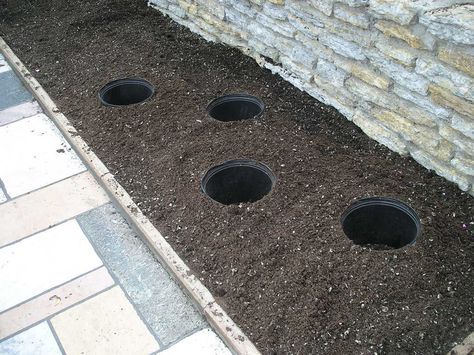 Flower pots in ground for annuals. Bury Pots In Garden, Buried Pots Garden, Sunken Pots In Garden, Pot In Pot Gardening, Flower Bed Designs, Backyard Flowers, Sunken Garden, Flower Pots Outdoor, Vertical Gardens