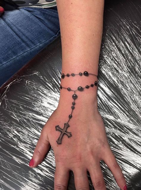 225+ Cute Rosary Tattoos Ideas and Designs (2023) - TattoosBoyGirl Rosary Tattoo For Women Arm, Rosery Tattoos On Hand, Tattoo Designs On Shoulder, Rosary Tattoo Design, Rosary Tattoo Wrist, Roseary Tattoo, Shock Tattoo, Rosary Tattoo On Hand, Rosary Bead Tattoo