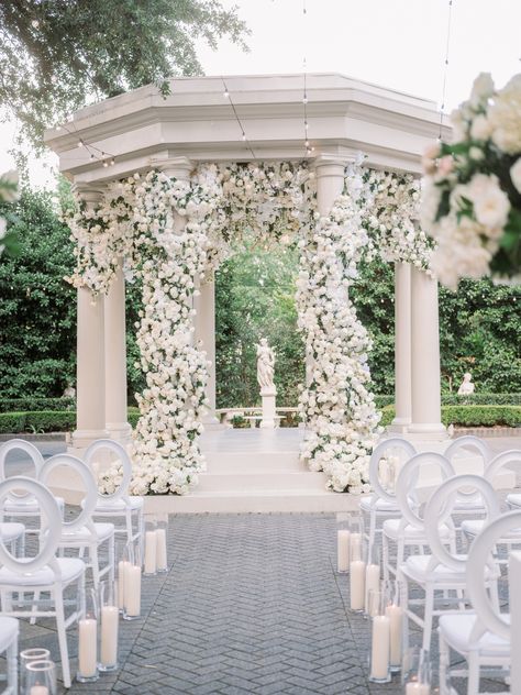 Embrace the Elegance: The Enchanted Gazebo at Elms Mansion 🌿✨ A picturesque canvas for your love story, where white blooms and lush greenery create a magical ceremony backdrop. Make your dream wedding a reality at this timeless venue. 💍 Wedding Gazebo Flowers, Gazebo Wedding Ceremony, Gazebo Wedding Decorations, Floral Wedding Ceremony, Wedding Pergola, White Gazebo, Gazebo Decorations, Gazebo Wedding, Wedding Ceremony Backdrop