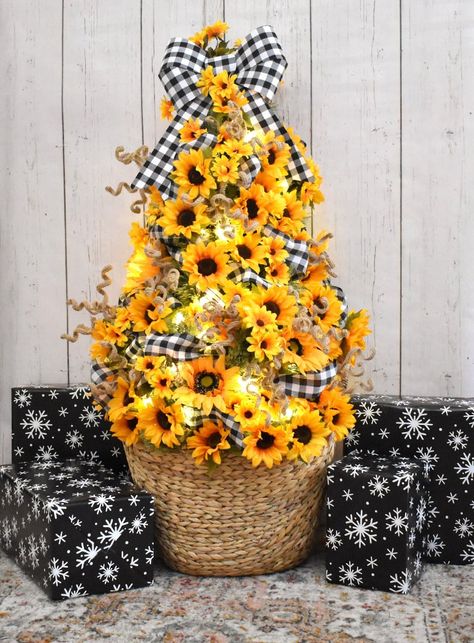 Looking for a happy non-traditional Christmas tree? Love flowers? This DIY Sunflower Christmas Tree is gorgeously cheerful and maybe a little bit country! This year I'm pretty much bypassing Thanksgiving decorating and crafting in favor of getting an early start on the Christmas season. It has been decided that to really Christmas up my parents' house, where we will have our festivities this year, we're going to have a bazillion Christmas trees. Each bedroom will have a 4-foot tree with its ... Sunflower Christmas Tree, Sunflower Tree, Sunflower Christmas, Green Christmas Tree Decorations, Diy Sunflower, Sunflower Crafts, Christmas Tree Lots, Burlap Christmas Tree, Unique Christmas Trees