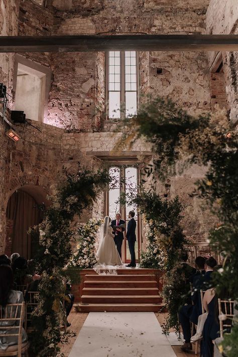 Lulworth Castle wedding venue in Dorset with botanical floral arrangements and columns decorating the venue Altar Decorations Wedding, Ethereal Castle, Green Mismatched Bridesmaid Dresses, Sage Green Colour Palette, Flower Columns, Retro Wedding Cake, Fort Wedding, Bella Wedding, Castle Wedding Venue