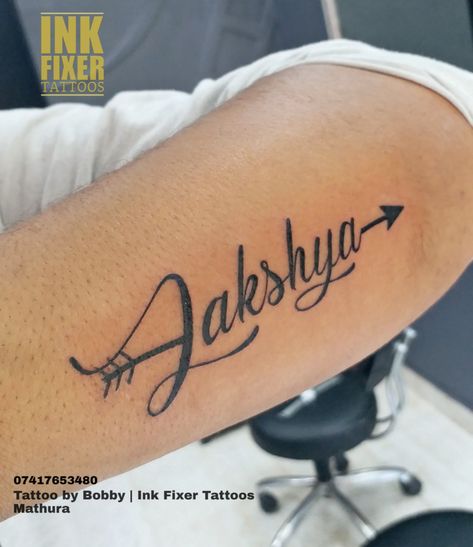 Lakshya name calligraphy Tattoo Done at Ink Fixer Tattoo studio | Mathura   Finest tattoo studio in Mathura  On Instagram - @inkfixertattoos  #tattooshopinmathura #tattooartistinmathura #tattoostudioinmathura #besttattooshopinmathura #nametattoo #inkfixertattoos #inkfixertattoostudio #neatwork #cleanwork #tattooonwrist #arrowtattoo Tattoo Fixers, Best Tatto, Name Tattoo Ideas, Quotes Doodles, Calligraphy Quotes Doodles, Flag Images, Name Calligraphy, Indian Flag Images, Marathi Calligraphy