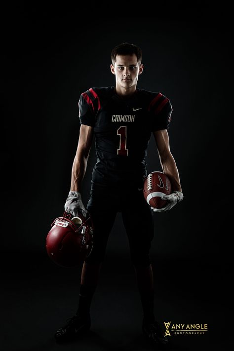 Senior pictures of a guy in his football uniform with football in a studio with dark background. #seniorpictures #footballplayer #seniorguy #studio #anyanglephotography #minnesota #footballposes Senior Football Photography, Football Senior Photos, Football Players Pictures, Football Senior Pictures, Composite Images, Angle Photography, Cheer Photography, Football Poses, Football Players Photos