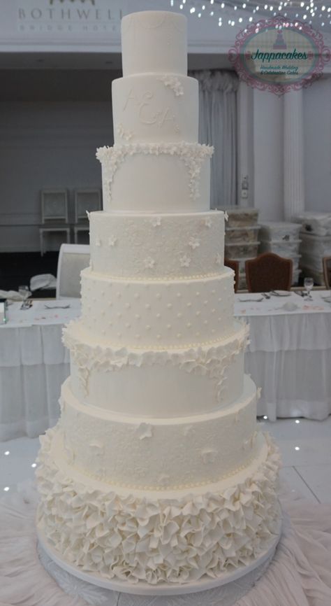 8 tier, all white wedding cake with hand piped detailing and ruffles. 6 Tier Wedding Cakes, All White Wedding Cake, Bolo Musical, Fake Wedding Cakes, 5 Tier Wedding Cakes, Tall Wedding Cakes, Extravagant Wedding Cakes, Funny Airport Signs, Wedding Cake Display