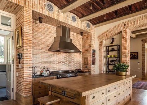 Rustic elements like Curved wood slat ceiling and brick walls give the transitional kitchen a timeless look [Design: Wynand Wilsenach Architects] Brick Wall Kitchen Ideas, Brick Pattern Tile, Reclaimed Wood Countertop, Brick Wall Kitchen, Wood Slat Ceiling, Patterned Kitchen Tiles, Wood Countertops Kitchen, Brick Accent Walls, Reclaimed Wood Kitchen