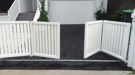 Bi-Fold Gates | SFG Sydney Fences and Gates Backyard Fence With Sliding Gate, Carport Gate Ideas, Front Porch Gate Ideas, Wooden Fence Gate Ideas, Fence Gate Ideas, Porch Gate, Wooden Fence Gate, Build A Fence, Folding Gate