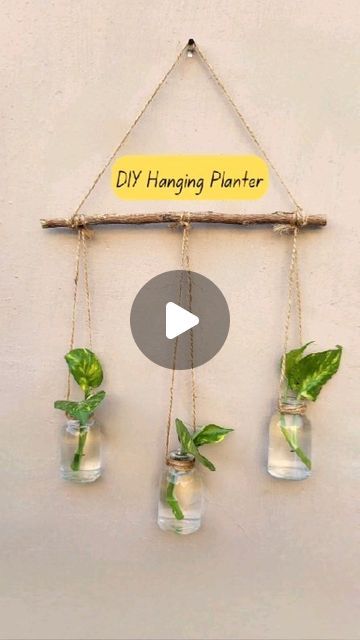 Bloomy on Instagram: "DIY Wall Hanging Mini Planter. I made this planter by using old mini glass bottles. Let me know if you have any questions. 😊 . . . #diyplanter #hangingplanter #diy #reuse #plantdecor #sustainableart #enviromentallyfriendly #creativeideas #wastetoart" Glass Bottle Wall Decor, Mason Jar Hanging Planter, Diy Hanging Planter Easy, Diy Hanging Propagation Station, Glass Bottle Planters Diy, Wall Planters Indoor Diy, Plastic Bottle Planters Diy Hanging, Bottle Hanging Plants, Diy Wall Planter Indoor