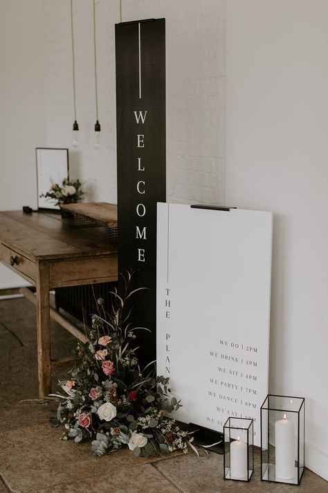 Tall vertical black and white wedding welcome sign with black and white order of the day sign surrounded by pink wedding flowers Black And White Wedding Signage, Black Wedding Sign, White Wedding Welcome Sign, Black And White Wedding Reception, Order Of The Day Sign, Rustic Wedding Signage, Wedding Entrance Sign, Brand Party, Event Signs