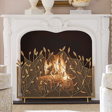 The lacy branch and leaf design was created by our own talented artist. Our Branches Fire Screen is handmade of powder-coated iron and decorated with beautifully detailed leaf details. An antique brass finish is hand applied to give this decorative fireplace guard a warm, golden glow. Branches Fire Screen features: Antique brass finish with gold accents Leaf & branch details Handmade of powder-coated iron Rust-resistant Boho Fireplace Screen, Brass Fireplace Fender, Brass Vent Covers, Decorating With Brass Accents, Inside Fireplace Decor, Faux Fireplace Decor, Fireplace Screen Ideas, Gold Fireplace Screen, Empty Fireplace Ideas