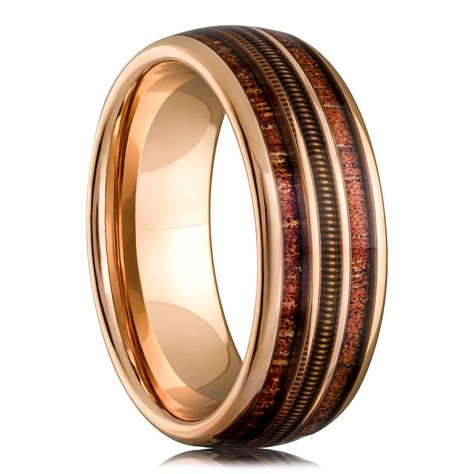 PRICES MAY VARY. Unique Design: The Guitar String Whiskey Barrel Men's Wedding Ring features a striking rose gold and tungsten blend with a genuine whiskey barrel wood inlay and an intricately woven guitar string, making it a unique and meaningful symbol of your love for music. Recycled Materials: Crafted with sustainability in mind, this ring showcases a blend of recycled materials, making it an eco-friendly choice. Durable and Scratch-Resistant: Made from robust black tungsten, this ring is de Tungsten Men’s Wedding Band, Men’s Gold Band, Men’s Engagement Rings, Mens Unique Wedding Bands, Whiskey Barrel Rings, Unique Mens Wedding Bands, Whiskey Barrel Ring, Wedding Ring Images, Whiskey Wedding