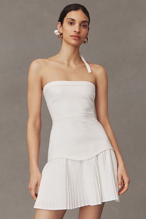 The Talia Dress is a flirty mini that features a strapless neckline, drop-waist silhouette, and pleated skirt for extra flair. | Talia Strapless Mini Dress by BHLDN in White, Women's, Size: XL, Polyester/Polyamide/Viscose at Anthropologie Best Graduation Dresses, College Grad Dresses, Corset Style Dresses, Rehearsal Dinner Dresses, Anthropologie Wedding, Bridal Shower Dress, Bridal Event, Shower Dresses, Grad Dresses