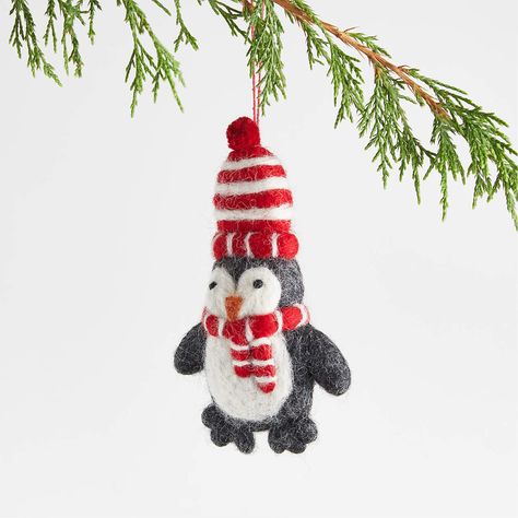 Felted Wool Bundled Penguin Christmas Tree Ornament + Reviews | Crate and Barrel Green Christmas Tree Decorations, Penguin Christmas Ornaments, Felt Penguin, Hat Ornament, Animal Ornaments, Striped Hat, Penguin Ornaments, Classic Christmas Tree, Red Green Christmas