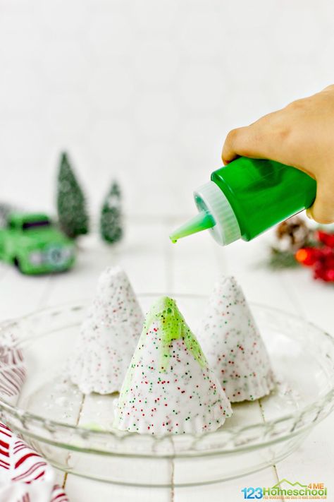 Pour a mixture of green food coloring and vinegar slowly onto the frozen trees to turn the trees green and melt the Christmas trees in this baking soda and vinegar science project for kids Christmas Science Experiments For Kids, Preschool Christmas Worksheets, Christmas Therapy, Christmas Science Activities, Christmas Science Experiments, Christmas Learning, Preschool Christmas Activities, Holiday Science, Science Experiments For Kids