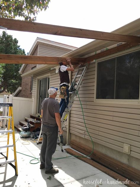 Building a pergola attached to the house. How to attach cross beams to the header. Housefulofhandmade.com How To Attach A Pergola To A House, Building A Pergola Attached To House, How To Attach, How To Anchor Pergola To Concrete, Awning Attached To House, How To Build A Pergola, Patio Awning Attached To House, Pergola On Patio, Build An Awning