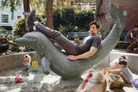 Adam Driver on top of a stone dolphin with a sand castle on top of him in a playground Adam Driver Marine, Adam Driver Girls, Adam Driver Tumblr, Adam Sackler, Morgan Evans, Kylo Ren Adam Driver, Jamie Fraser Sam Heughan, Emily Vancamp, Lena Dunham