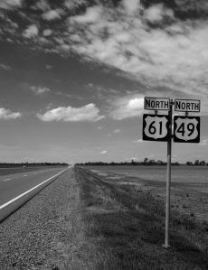 'Blues Highway' intersection of Highways 61 and 49—the crossroads, legend claims, where aspiring blues musician Robert Johnson sold his soul to the devil in exchange for the prodigious guitar-playing skills he acquired. Highway 61 carried poor rural musicians and sharecroppers out of the dusty Mississippi cotton fields in the 1930s and ’40s north towards Memphis and St. Louis, where audiences first clamoured for the raw, emotional singing and guitar playing that emerged from the Jim Crow Sou... Mississippi Delta Blues, Clarksdale Mississippi, Blues Music Poster, All Shades Of Blue, Mississippi Blues, Jazz Sheet Music, Delta Girl, Mississippi Delta, Robert Johnson