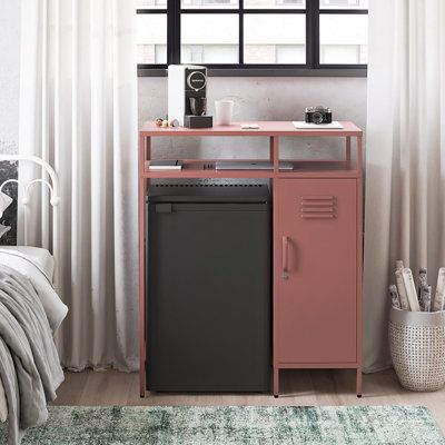 Keep your space chic and organized, no matter how cozy, with the Cache Metal Locker-Style Mini Refrigerator Organizer- a must-have for dorm dwellers, home office hustlers, and city slickers alike. Say goodbye to wasted nooks and crannies and hello to a sleek, upscale vibe in your abode. This compact wonder packs a punch with its clever mix of open and closed storage, perfect for tidying up your essentials or flaunting your faves. Plus, the top shelf serves up some serious horizontal real estate Mini Fridge Cabinet Office, Dorm Room Mini Fridge Storage, Desk Mini Fridge, Bedroom Mini Fridge Ideas, Gifts For First Apartment, Single Dorm Decor, Dorm Refrigerator Cabinet, Dorm Refrigerator Ideas, Bar Cart With Mini Fridge