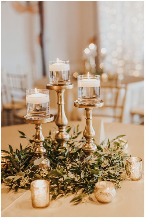 Bronze Centerpieces Wedding, Gold Accent Centerpiece, Gold Candle Wedding Centerpieces, Rustic Gold Wedding Decor, Gold Candle Stick Centerpieces, Trendy Wedding Centerpieces, White And Bronze Wedding Decor, Simple Candlestick Centerpieces Wedding, Mixed Centerpieces Wedding