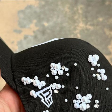 Creative Studio on Instagram: "svarovski/pearls prototype by @aguv4ro.studio 
great combination don’t you think?🫧✨

#customcap #creative #paris #svarovski #pearls #craftmanship #prototype #custom #fashion" Custom New Era Hats, Aesthetic Fashion Men, Custom Jeans Diy, Custom Fitted Hats, Hat Diy, Dope Hats, Pretty Hats, Custom Caps, Custom Jeans