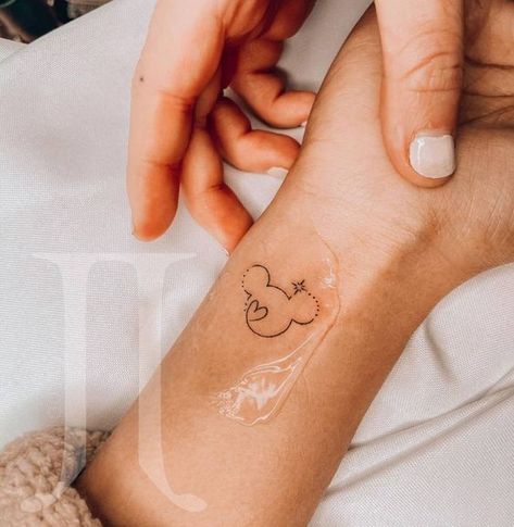 Mickey Tattoo. Disney Tattoos Wrist, Discrete Disney Tattoos, Mini Mickey Tattoo, Mickey Mouse Tattoo Minimalist, Ankle Tattoo Disney, Small Disneyland Tattoos, Feminine Disney Tattoo, Minnie Mouse Wrist Tattoo, Disney Tiny Tattoo Ideas