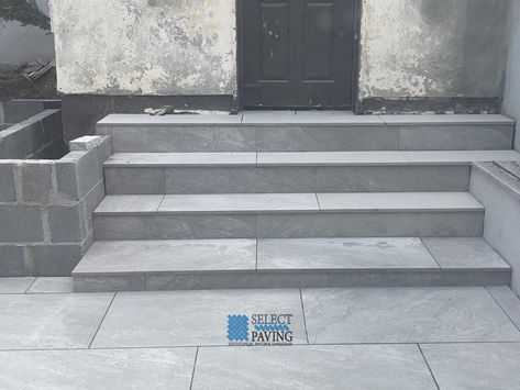 Porcelain Tiled Patio with Steps and Walling in Saggart, Co. Dublin https://www.selectpaving.ie/projects/porcelain-tiled-patio-with-steps-and-walling-in-saggart-co-dublin/ Steps From Patio Doors To Garden, Tiled Garden Steps, Porcelain Steps, Porcelain Patio Steps, Front Stoep Tiles, Porcelain Patio With Steps, Porcelain Steps Garden, Wide Patio Steps Down To Garden, Paver Steps