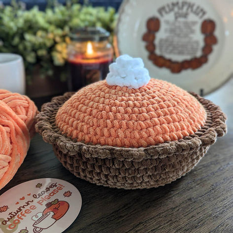 if you enjoy crocheting plushies, you'll love this pumpkin pie free crochet pattern. This crochet food can be used for a pillow, or you can add it to your plush collection. Crochet Fall Pillows Free Patterns, Crochet Pumpkin Pillows, Crochet Pie Patterns, Pumpkin Pie Pillow, Pumpkin Pie Turtle Crochet, Pumpkin Pie Crochet Pattern Free, Crochet Pumpkin Pie Pillow, Cute Crochet Pumpkin, Pumpkin Pie Crochet Pattern