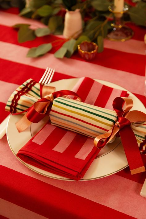 A classic stripe in a cheerful, holiday palette, complete with gold metallic accents for extra sparkle this season. A show stopping stripe perfect for any table, tree, stocking or Christmas Eve box for your Holiday traditions. Made by Happy Crackers with 100% Cotton. Fully reversible with matching soft off white Linen with Forest or Red Ric Rac trims with double matching Ties. Crackers come with a ready to fill carton and lid inside. Fill with your own novelties and surprises. Each Cracker is ha Christmas Table Crackers, Traditional Christmas Table, Colourful Christmas Table, Pink And Green Christmas Table, Christmas Stripes, Colorful Christmas Table, Christmas Tables, Pink And Red Christmas, Red Color Pallets