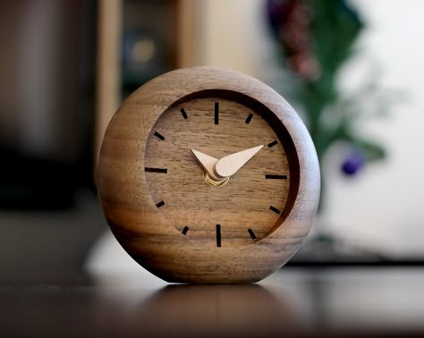 🕓 Do you want to add a touch of timeless elegance to your space? Look no further than our handcrafted walnut wood table clock! Made from natural walnut wood, each clock boasts a unique grain pattern, making it a one-of-a-kind piece of art. With its minimalist design and tasteful engraving, this clock effortlessly blends sophistication with functionality.  🕓 Whether placed on your bedside table or desk, its reliable quartz movement ensures precision timekeeping, keeping you on track throughout Small Desk Clock, Workbench Plans Diy, Desktop Clock, Clock Vintage, Wood Clock, Unique Table, Profile Header, Wood Clocks, Natural Walnut