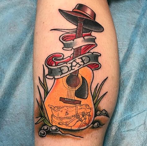 CafeMom.com : Guitar Dad Tattoo : 50 Truly Incredible Tattoos to Pay Tribute to Dad -- Carefully planned tattoo details -- including the delicate line drawing of a horse's face on the bottom of the guitar -- paint a vivid picture of this rocking dad. Dad Tattoo Ideas, Enough Tattoo, Stag Tattoo, Guitar Tattoo Design, Cowboy Tattoos, Dad Tattoo, Guitar Tattoo, Traditional Tattoo Sleeve, Tattoos Skull