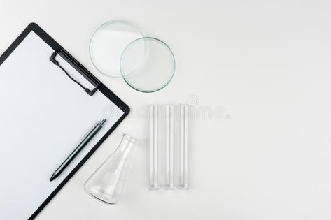 Photo about Top view of laboratory equipments. A clipboard with pen, flask, test tubes and watch glass on the table. Image of empty, copy, pharmaceutical - 119708248 Table Top View, Test Tubes, Laboratory Equipment, Test Tube, Clipboard, Top View, The Table, Chemistry, Flask