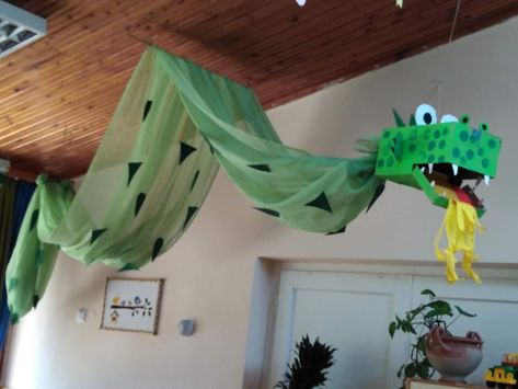 Dragon Ceiling Decoration, Hanging Dragon Decoration, Fairy Tale Ball Decorations School, Dragon Library Display, Fairy Tale School Theme, Castle Classroom Decorations, Medieval Classroom Decor, Dragon Bulletin Board Ideas, Medieval Party Decorations Diy