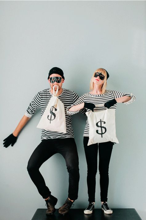 Steal the show with this adorable costume for two. (You can also wear this with your significant other or even your kids!) Get the tutorial at Say Yes. What you'll need: Black and white striped shirt ($12; amazon.com); Black half mask ($4; amazon.com) Halloween Costume Ideas Diy, Carnaval Costumes, Two Person Halloween Costumes, Easy Homemade Halloween Costumes, Bonnie And Clyde Halloween Costume, Costumes Carnaval, Inspired Costumes, Best Group Halloween Costumes, Funny Couple Halloween Costumes