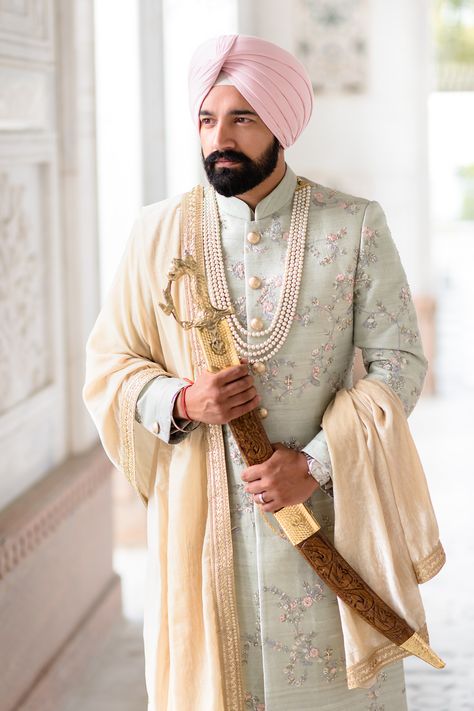 Here's real groom Raj wearing his soft mint green sherwani on his wedding day at Gravesend Gurdwara. His pink turban from Bespoke Turbans (UK) adds to the contemporary look. Achkan For Men Indian Weddings Punjabi, Mens Wedding Sherwani Indian, Best Wedding Sherwani For Groom, Pastel Green Sherwani Groom, Mint Green Sherwani, Dulha Sherwani Wedding For Men, Sikh Groom Outfit, Pink Sherwani For Groom, Hindu Wedding Outfit