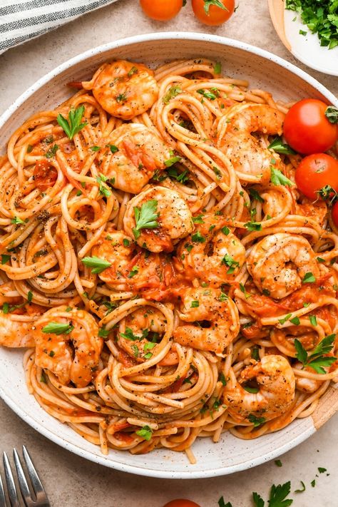 This simple burst cherry tomato and shrimp pasta is so simple but so incredibly flavorful! Made with fresh cherry tomatoes, lots of garlic, and a little bit of tomato paste to bolster the tomato flavor, it is made without cream and dairy free. We opt for GF pasta to keep the recipe gluten free, but any pasta you like will work! It is all cooked in one skillet and ready in just 30 minutes. Adding chopped parsley brings some color and elegance to the dish, making it just as perfect for serving guests as it is for a quick weeknight dinner. Tomatoe Shrimp Pasta Recipes, White Wine Cherry Tomato Pasta, Shrimp Pasta Recipes Tomato, Pasta Sauce With Cherry Tomatoes, Shrimp Cherry Tomato Pasta, Blistered Cherry Tomatoes Pasta, Shrimp Tomatoes Pasta, Shrimp Sun Dried Tomato Pasta, Shrimp And Tomato Pasta