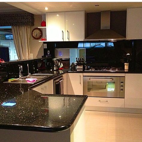 Kitchen Black Splashback, Black Galaxy Countertops Kitchen, Black Galaxy Granite Kitchen, Galaxy Granite Kitchen, Kitchen Black Granite, Kitchen With Black Granite, Black Tiles Kitchen, Window Header, Black Granite Tile