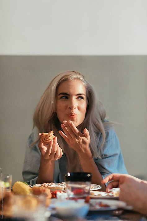 Portrait of a beautiful blond girl eating at a dinner party People Eating Dessert Photography, Family Dining Photography, People Sharing Food Photography, Happy Lifestyle Photography, People With Food Photography, Dinner Party Editorial, Food Photography With Model, Friends Dinner Party Food, Food Photography With People