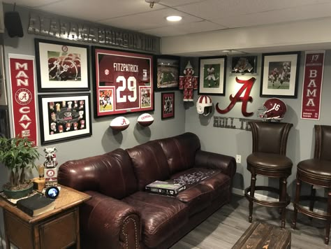 Sport Mancave Ideas, Man Cave Media Room Ideas, College Football Basement, Basement Game Room Wall Decor, Sports Living Room Decor, Sports Room Man Cave Football, Sports Theme Living Room, Classy Sports Basement, Alabama Man Cave Ideas